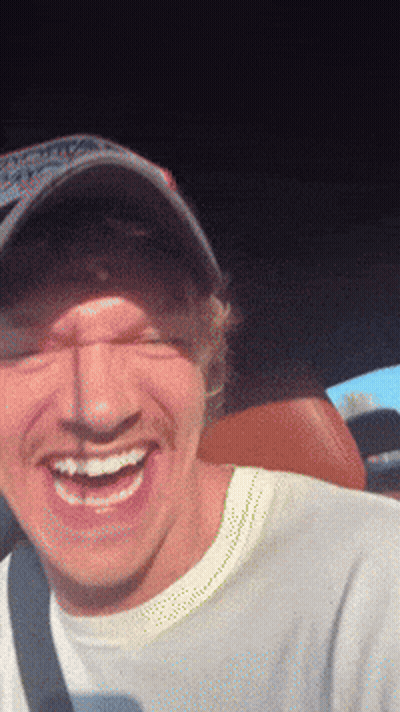 Man In Hat And White Shirt Smiling GIF
