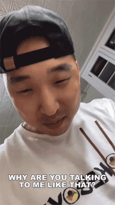 Man In Hat And White Shirt Talking GIF