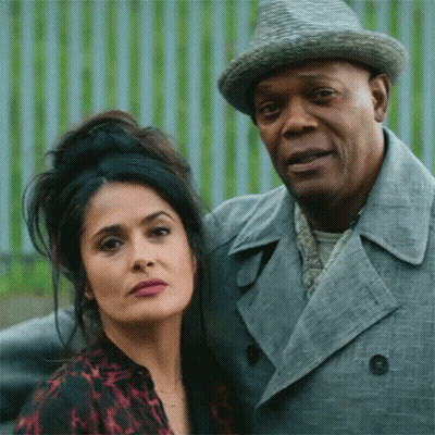 Man In Hat And Woman In Trench Coat Posing GIF