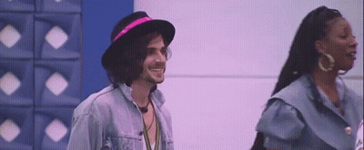 Man In Hat And Woman With Earrings GIF