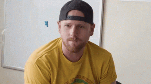 Man In Hat And Yellow Shirt Saying The Ground Breakers GIF