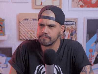 Man In Hat At Microphone Making Funny Face GIF