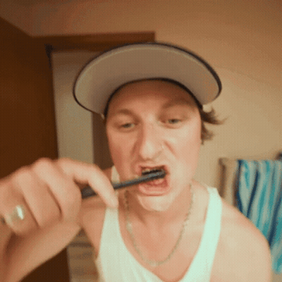 Man In Hat Brushing Teeth GIF