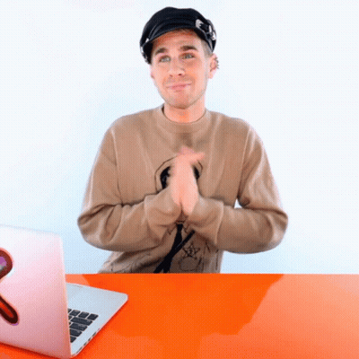 Man In Hat Clapping In Front Of Laptop With Letter G GIF