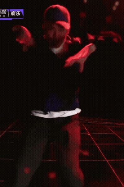 Man In Hat Dancing On Stage With Chinese Writing GIF
