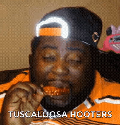 Man In Hat Eating Chicken Tuscaloosa Hooters GIF