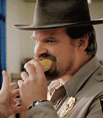 Man In Hat Eating Doughnut GIF
