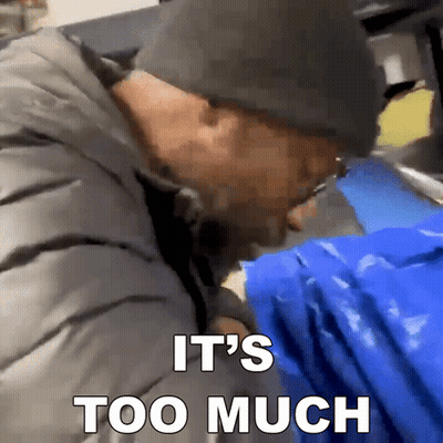 Man In Hat Holding Blue Bag Saying It's Too Much On The Bottom GIF