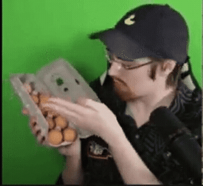 Man In Hat Holding Box Of Eggs GIF