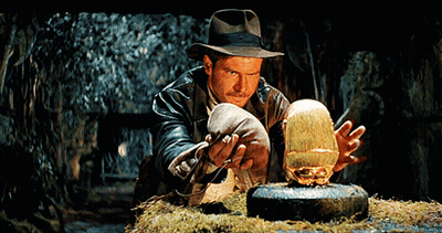 Man In Hat Holding Gold Object GIF