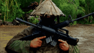 Man In Hat Holding Gun GIF