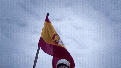 Man In Hat Holding Spanish Flag GIF