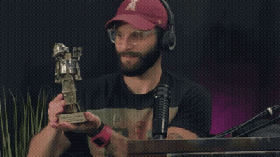 Man In Hat Holding Trophy GIF
