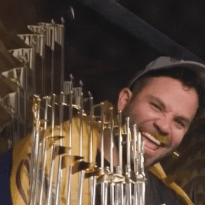 Man In Hat Holding Trophy GIF