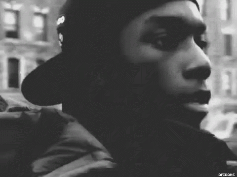 Man In Hat Looking At Camera GIF