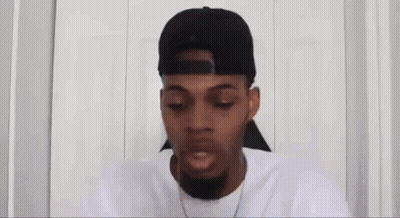 Man In Hat Looking At Cell Phone GIF