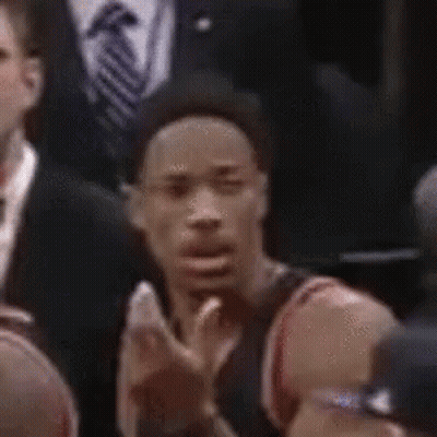 Man In Hat Making Funny Face In Crowd GIF