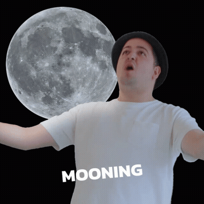 Man In Hat Mooning In Front Of Full Moon GIF
