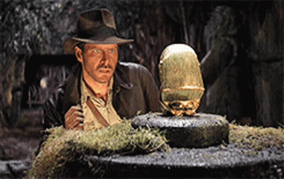 Man In Hat Next To Statue GIF