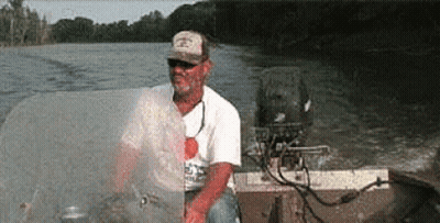 Man In Hat On Motorboat GIF