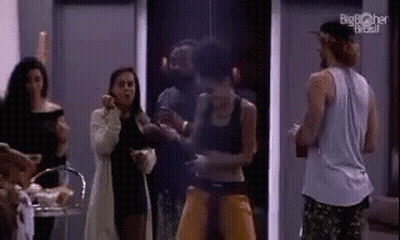 Man In Hat Opening Wine In Front Of Tomorrow Sign GIF