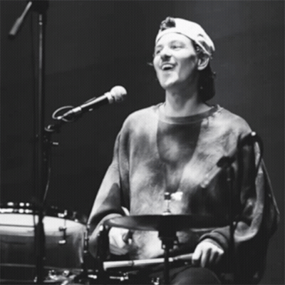 Man In Hat Playing Drums And Singing GIF