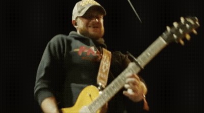 Man In Hat Playing Guitar On Stage GIF