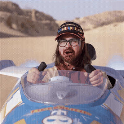 Man In Hat Saying Asiandaddies.com Driving Car GIF
