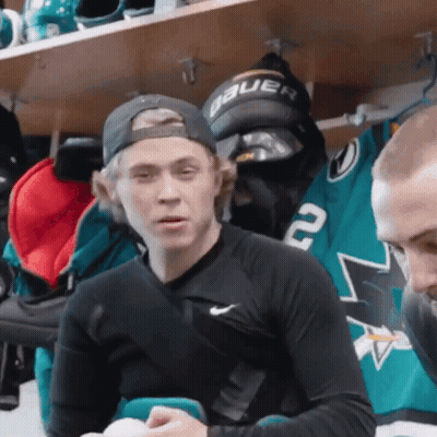 Man In Hat Saying Bauer Sitting In Locker Room GIF
