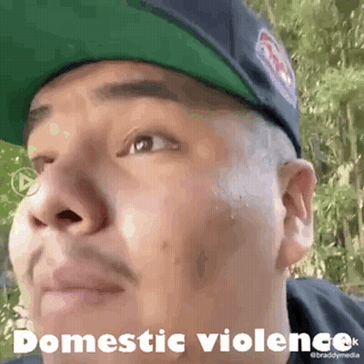 Man In Hat Saying Domestic Violence GIF