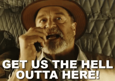Man In Hat Saying Get Us The Hell Outta Here On Phone GIF