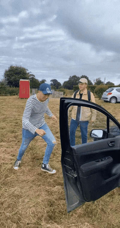 Man In Hat Saying SBS Standing Next To Car GIF