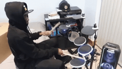 Man In Hat Saying T-II Plays Drum Set GIF
