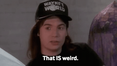 Man In Hat Saying That Is Weird Sitting In Room GIF