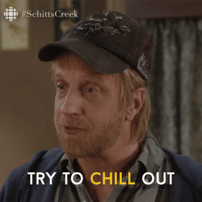 Man In Hat Saying Try To Chill Out GIF