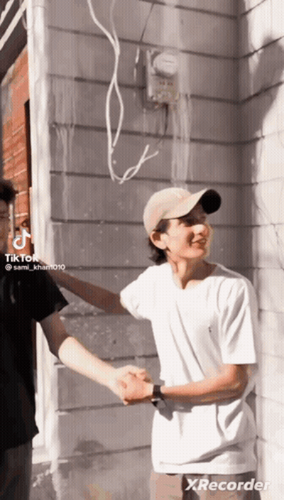 Man In Hat Shaking Hands With Man GIF
