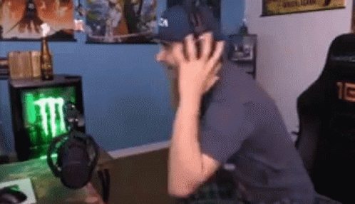 Man In Hat Sitting At Microphone GIF