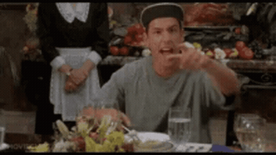 Man In Hat Sitting At Table With Water And Food GIF