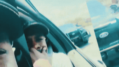 Man In Hat Sitting In Car With Ford Logo GIF