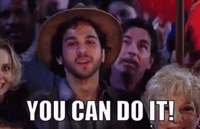 Man In Hat Sitting In Crowd Saying You Can Do It GIF
