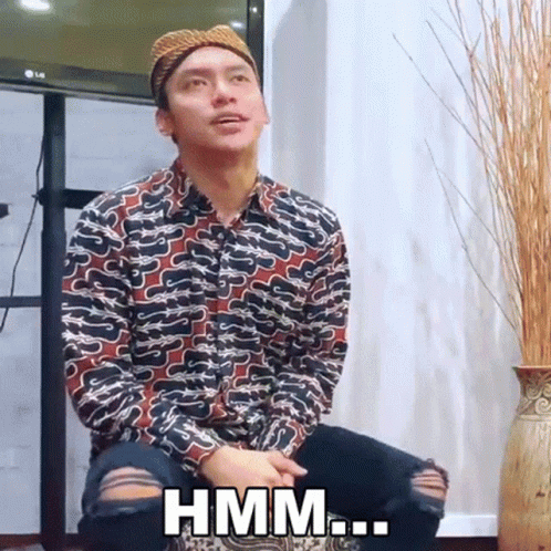 Man In Hat Sitting In Front Of LG TV Says Hmm GIF