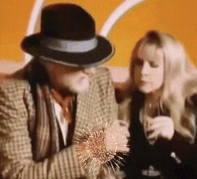 Man In Hat Sitting Next To Woman GIF