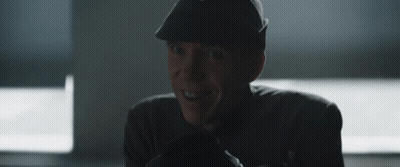Man In Hat Smiling In Dark Room GIF