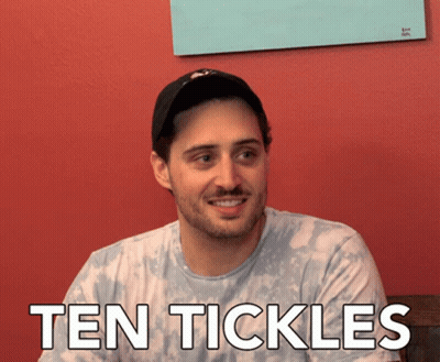 Man In Hat Smiling With Ten Tickles Shirt GIF