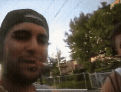 Man In Hat Smoking Cigarette Blurry Photo GIF