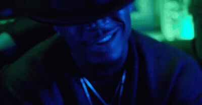 Man In Hat Smoking Cigarette In Dark Room With Blue Light GIF