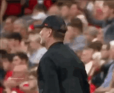 Man In Hat Standing Before Crowd GIF