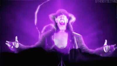 Man In Hat Standing Before Purple Lightning GIF