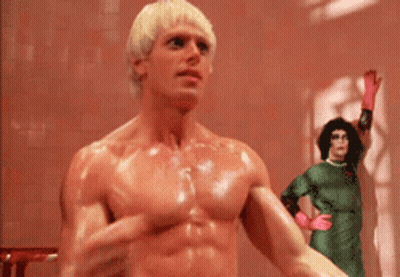 Man In Hat Standing In Doorway Says I Am Your Singing Telegram GIF