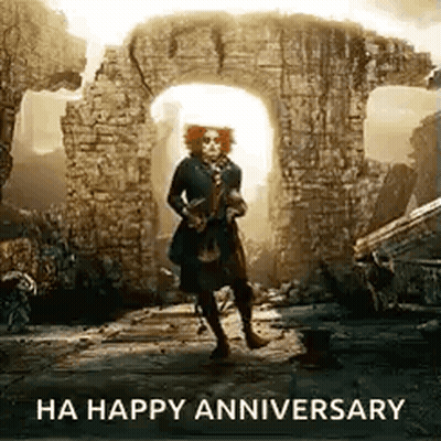 Man In Hat Standing In Front Of Brick Wall GIF